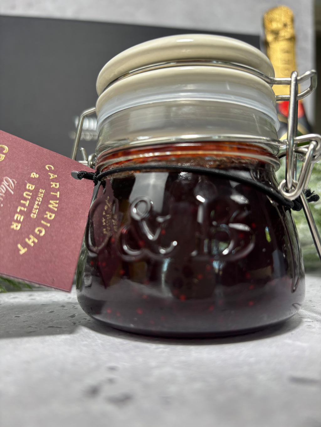 Cartwright & butler cranberry sauce. Glass jar with seal clamp lid with embossed C & B detail. 