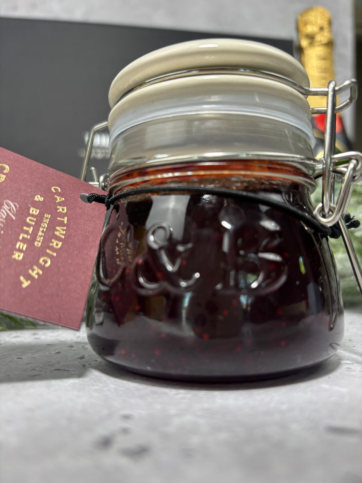 Cartwright & butler cranberry sauce. Glass jar with seal clamp lid with embossed C & B detail. 