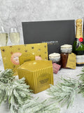 A Christmas Hamper gift box, showing moet & chardon Champagne, Cartwright & butler Christmas range including, brandy mince pies, cranberry sauce, Christmas chutney & traditional Christmas pudding.