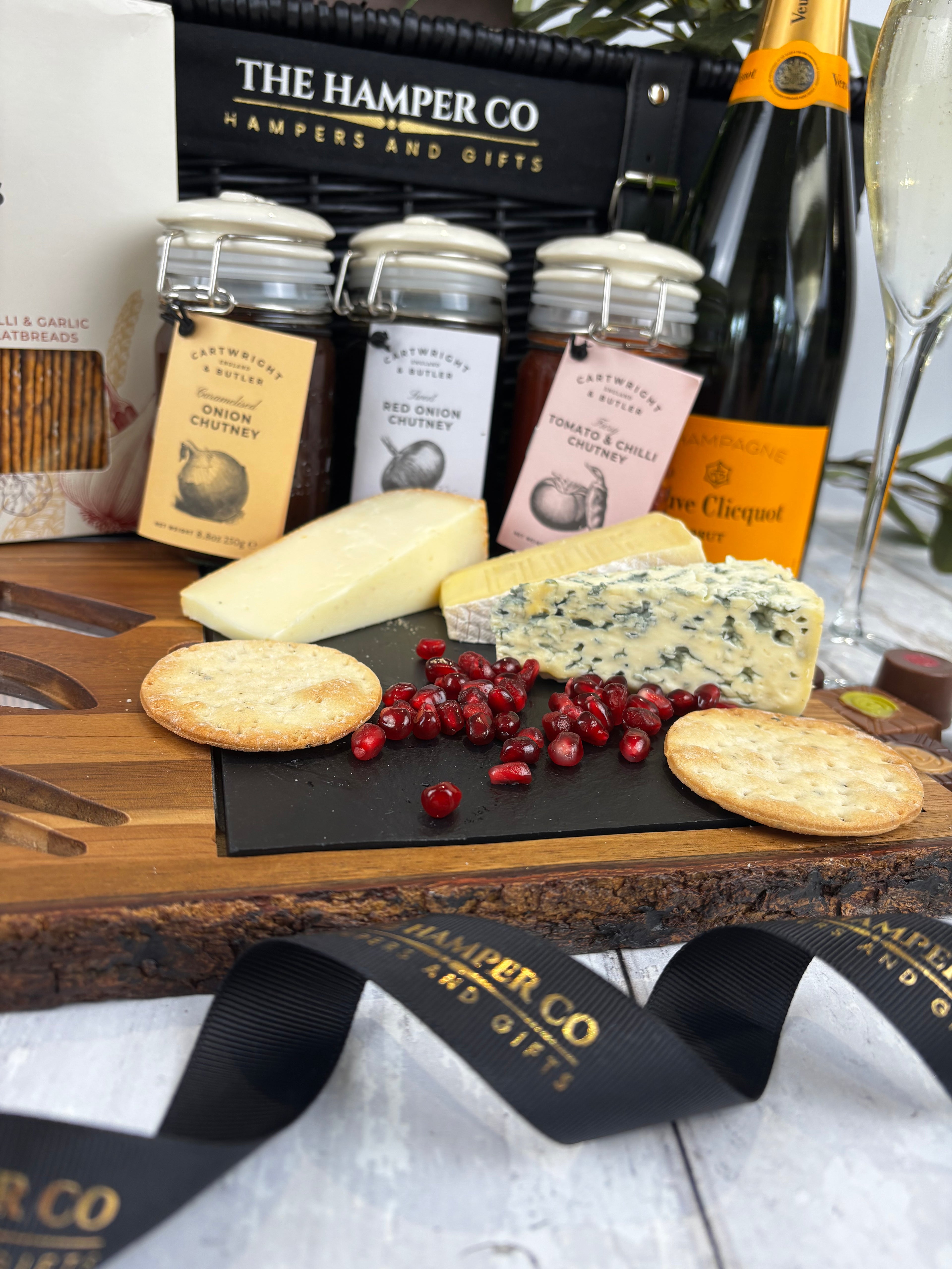 lytton house acacia wood cheese board, cartwright & butler chutney, verve cliquot champagne close up ribbon and chamagne 