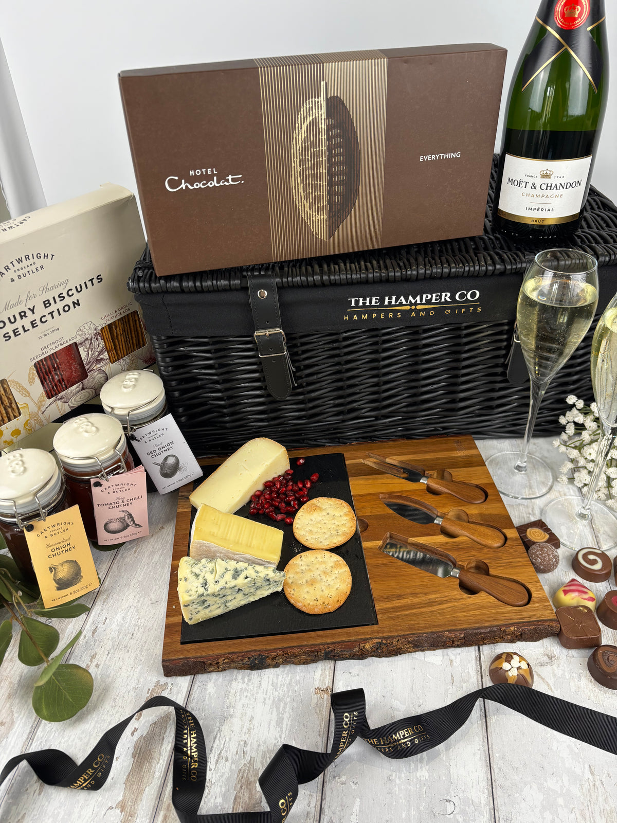 a luxury hamper with cartwright  & butler products, cheese board, moet & chardon champage, hotel chocolat 18 piece everything bo. luxury hampers