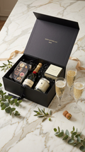 personalised luxury gift box with jo malone pomergrante noir candle, moet & chardon champagne, hotel chocolat. ribbon champagne glasses 